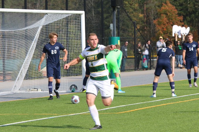 Keuka College student running on the field