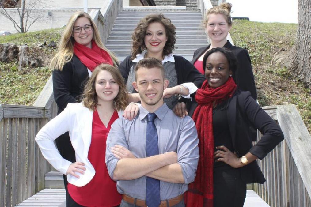 a group of students dressed up for interviews standing next to each other on steps