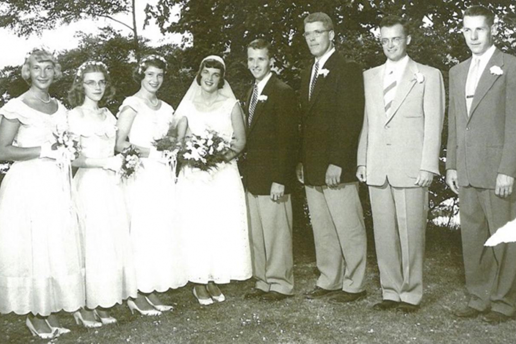 A wedding party in a black &amp; white photograph