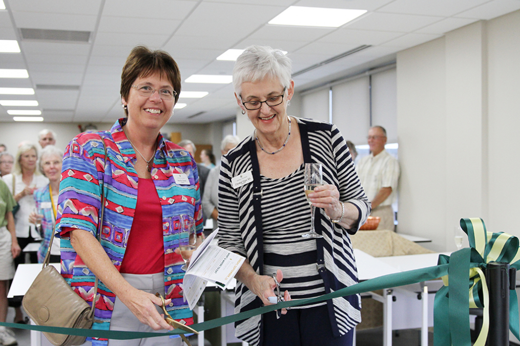 College trustees Martha Fallon Dieter, left, and Crystal J. Gips ’65 cut the ceremonial ribbon Friday evening formally opening the College's new Center for Art & Design. 