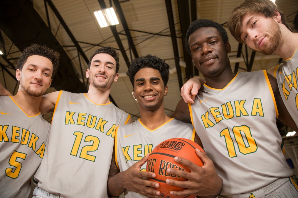 KC Basketball Team posing on the court