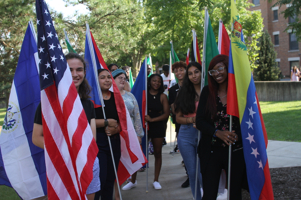 Students holding flags 