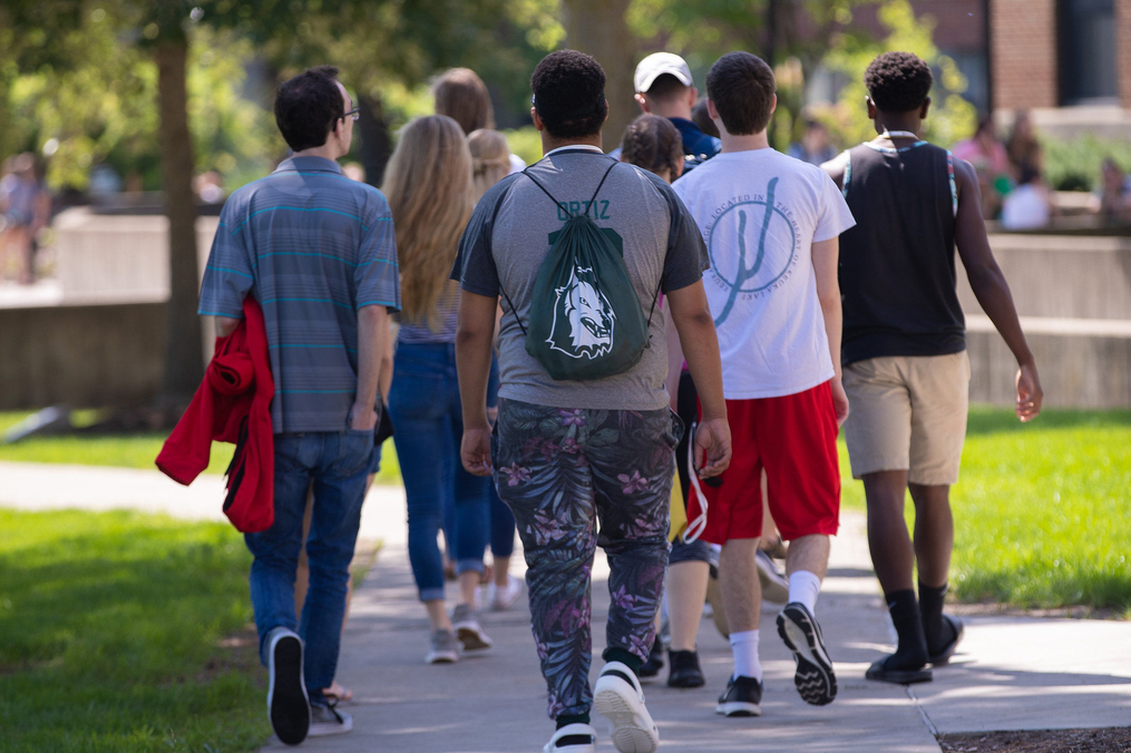 Group of students walking through campus toward Dahlstrom Student Center