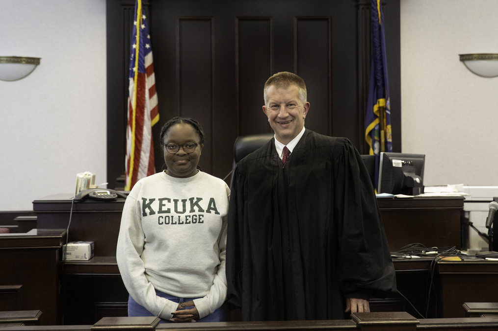 Kameisha Reid and Supreme Court Justice Jason Cook in the Yates County Courthouse