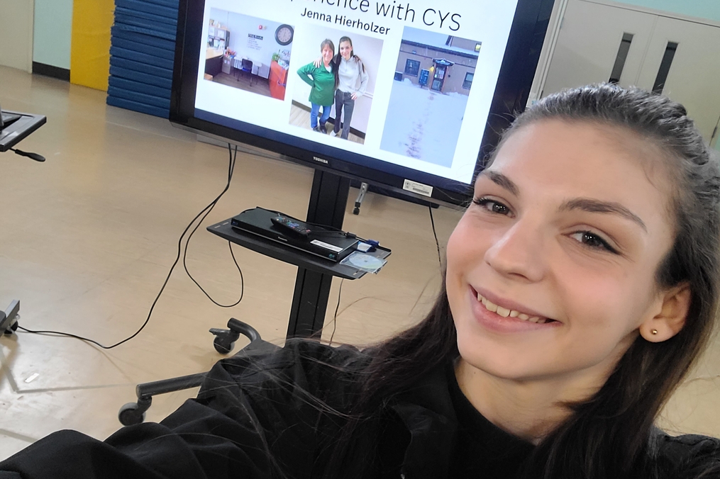 Jenna Heirzholzer takes selfie with presentation at KCx