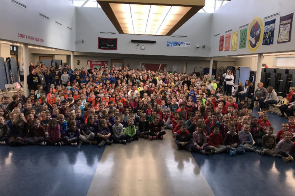Students at Canalview Elementary School in Spencerport, N.Y. listen as Joe Maier '16 M'17 and Dalton Letta share their story through a presentation titled "No One Eats Lunch Alone."