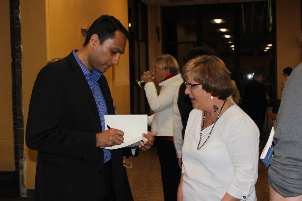 Eboo Patel, founder and president of Interfaith Youth Core, and the featured speaker at the 29th Annual Carl and Fanny Fribolin Lecture, speaks with Stephanie Craig at a reception following the lecture on May 5, 2017.