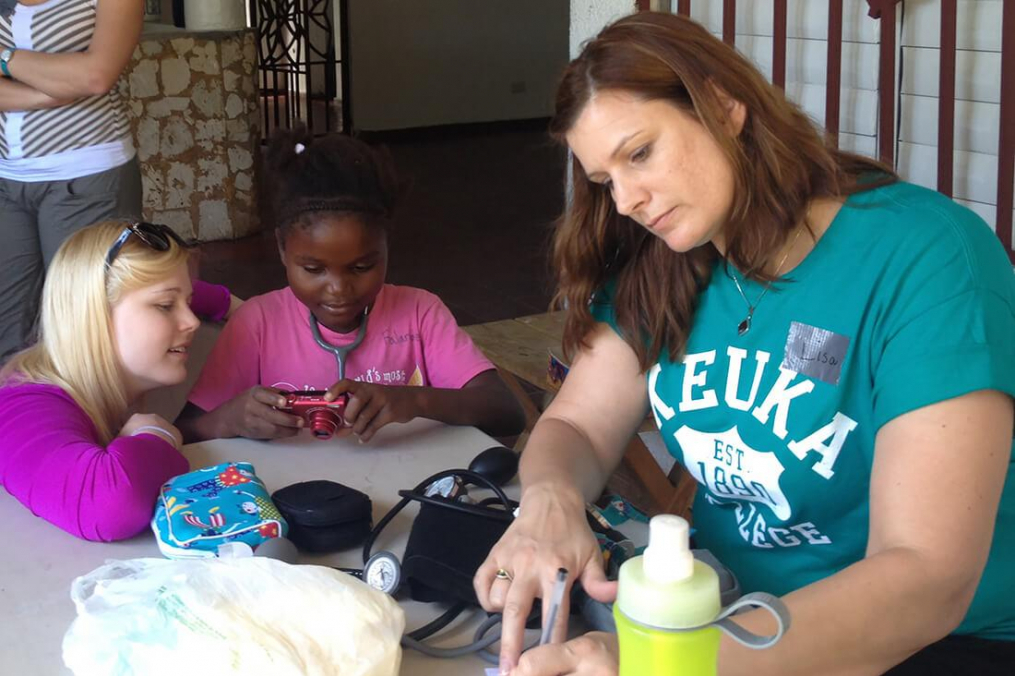 Keuka College nursing students work with a child in the Dominican Republic