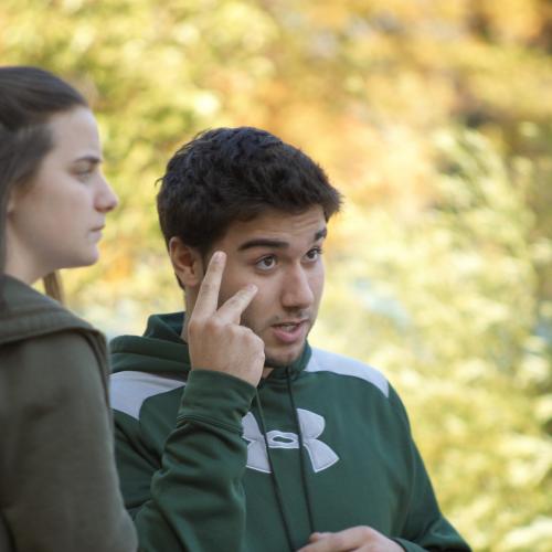 student doing sign language